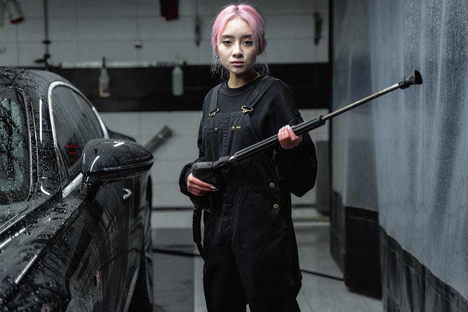 Dedicated professional performing a hand car wash